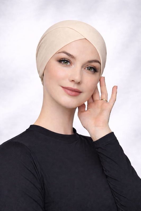 Schlauch Bonnet über Kreuz crembeige